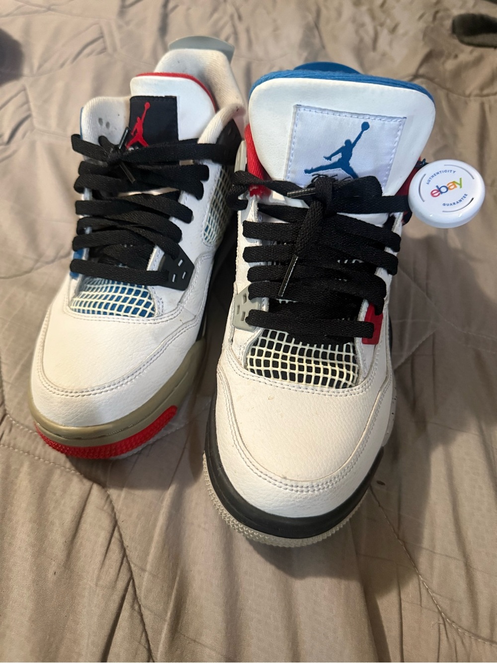 Nike Kids White Sneakers with Red and Blue Accents